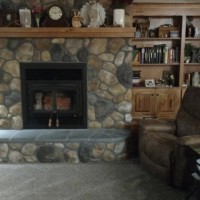Bricklayer creates stone fireplace
